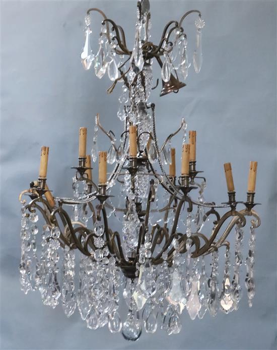 An Italian bronze and cut glass twelve light chandelier, overall drop 4ft., diameter 3ft